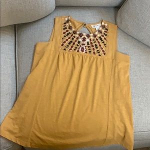 mustard colored blouse with details